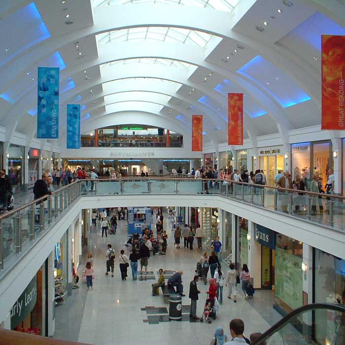 A large group of people in an indoor mall.