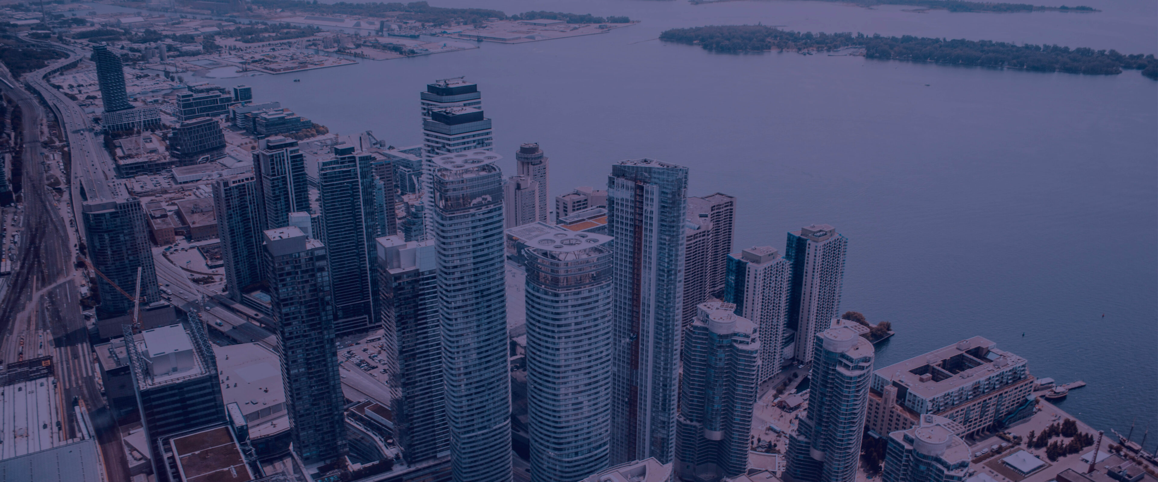 A view of some buildings and water from above.